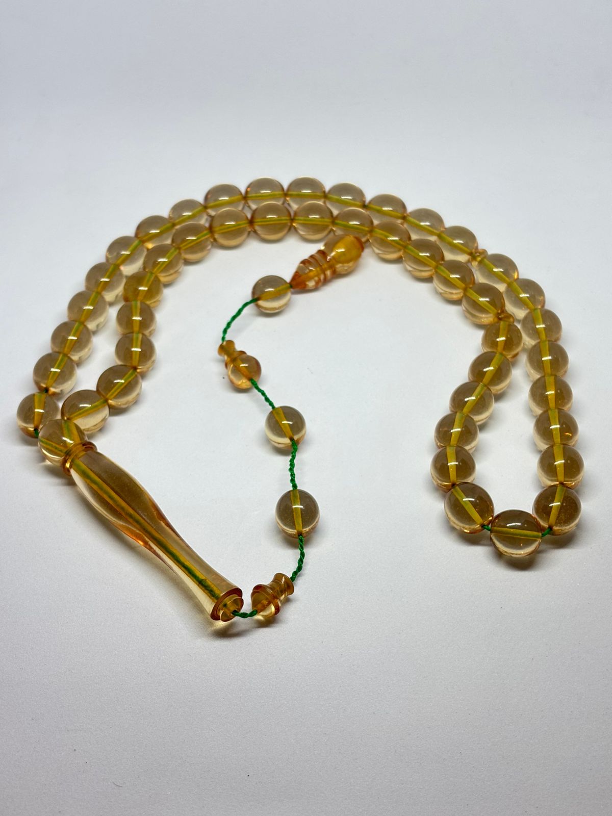 Amber Glow & Green Thread: A Tasbih That Radiates Tranquility