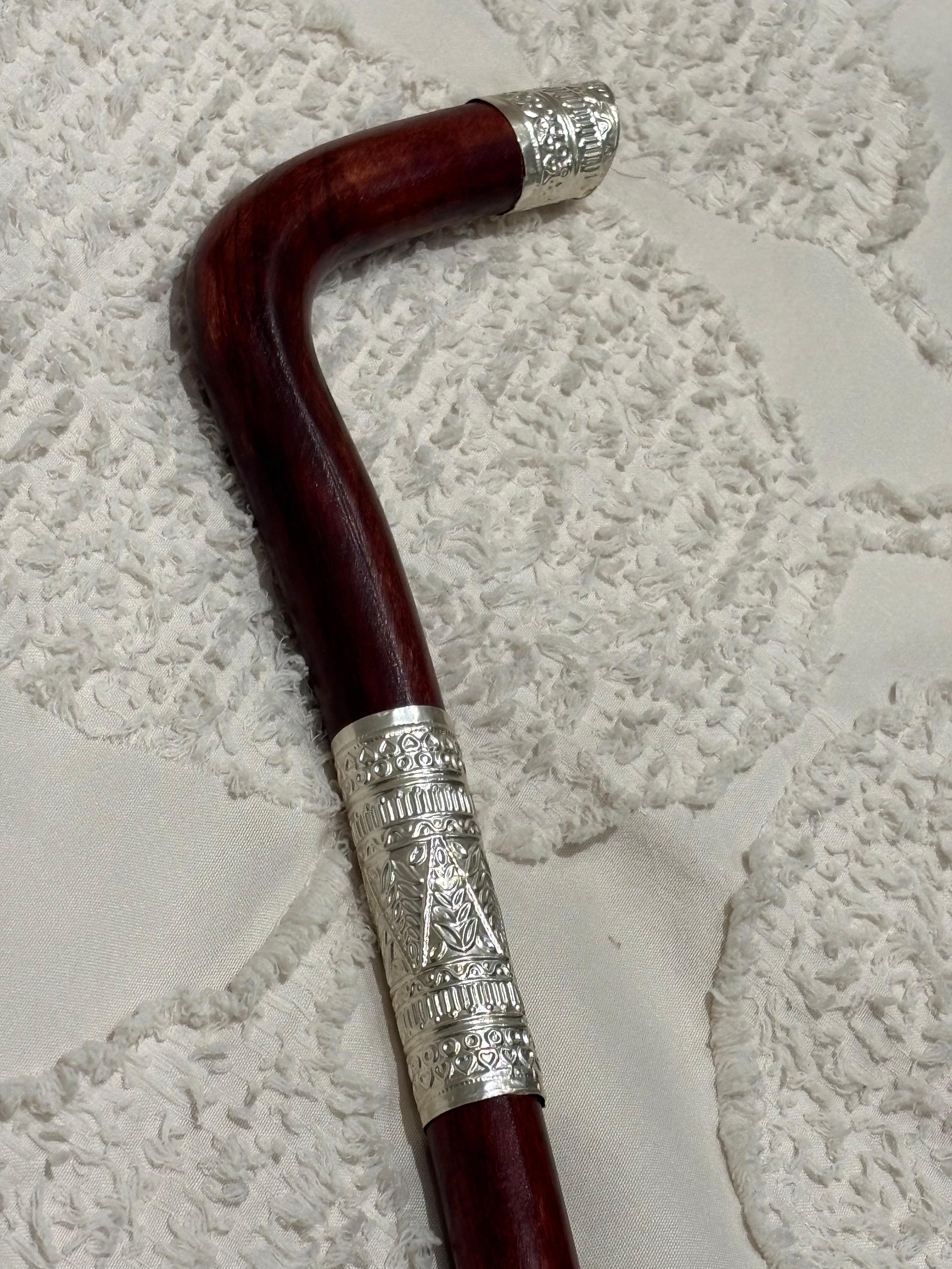Intricate Silver-Capped Wooden Walking Cane with Decorative Engraving