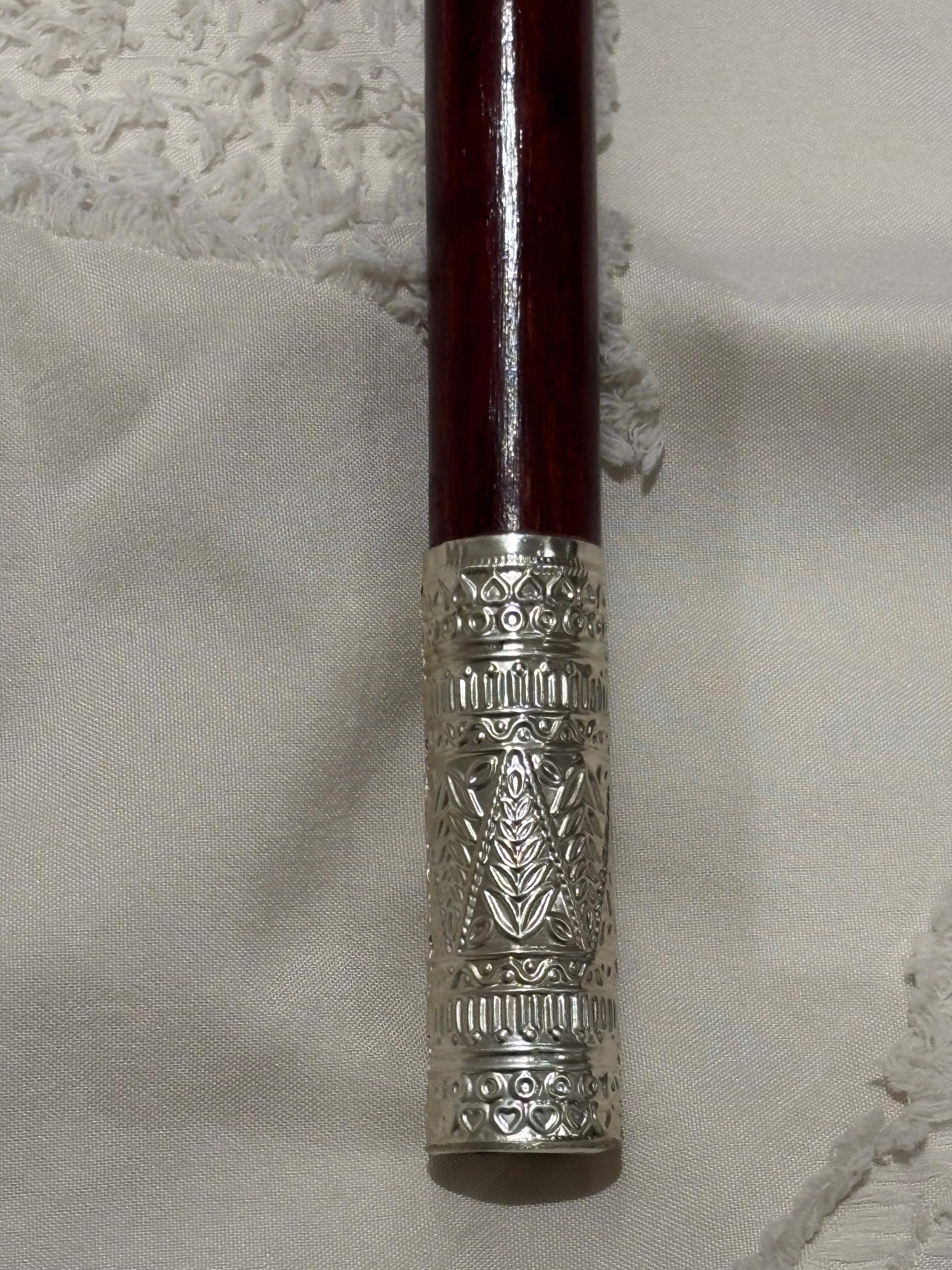 Intricate Silver-Capped Wooden Walking Cane with Decorative Engraving